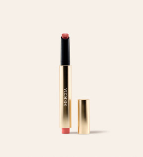 Hydrating Lip Tint in Peachy Rose featuring a sleek gold metallic pen with a detached cap against a neutral background.