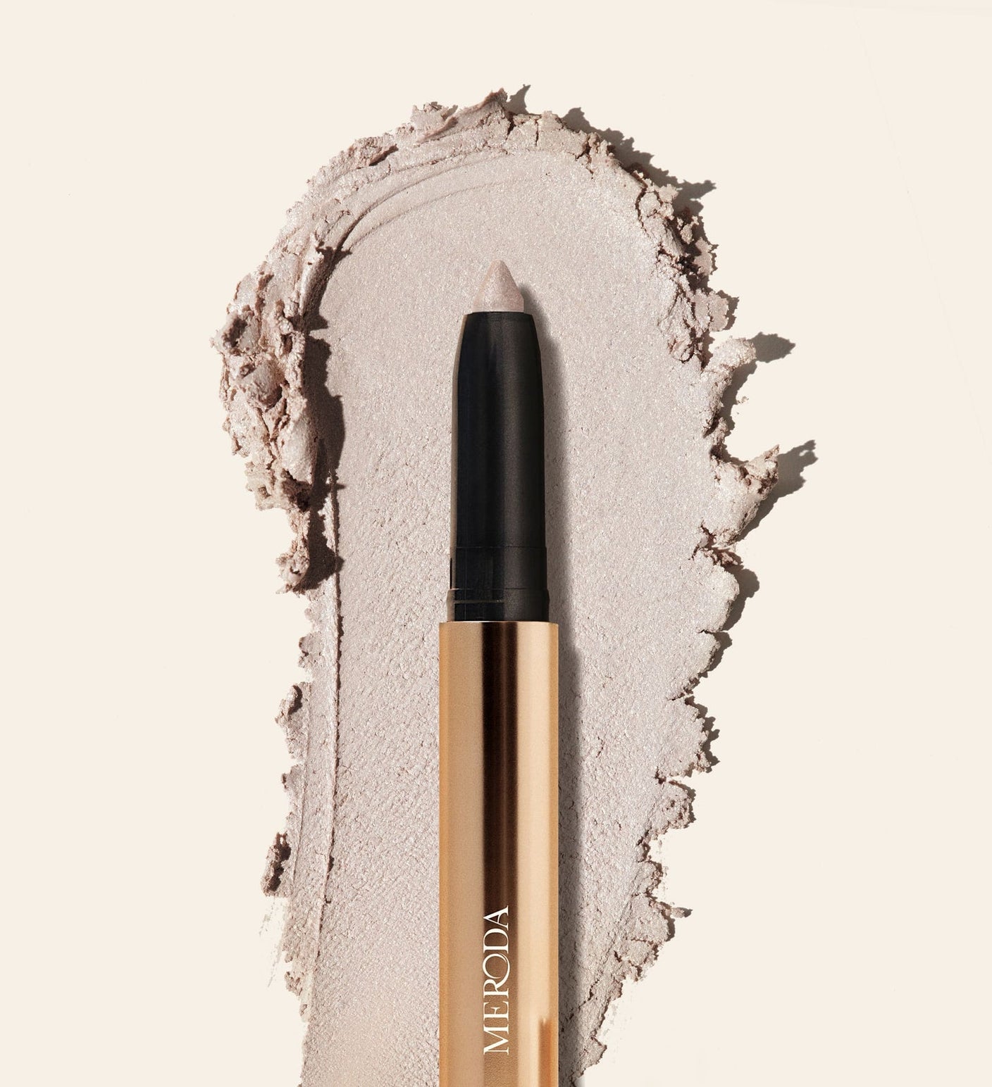Eye Perfecting Shimmer Stick in Pearl with a creamy, radiant texture swatch to brighten your eye colour.
