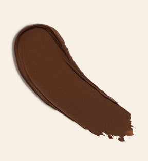 Soft Tan Bronzer texture swatch in shade Deep showing the creamy formula for a natural sun-kissed glow.