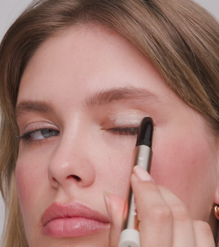 Eye Perfecting Shimmer Stick applied to eyelids for a luminous, shimmering finish that brightens the eyes.