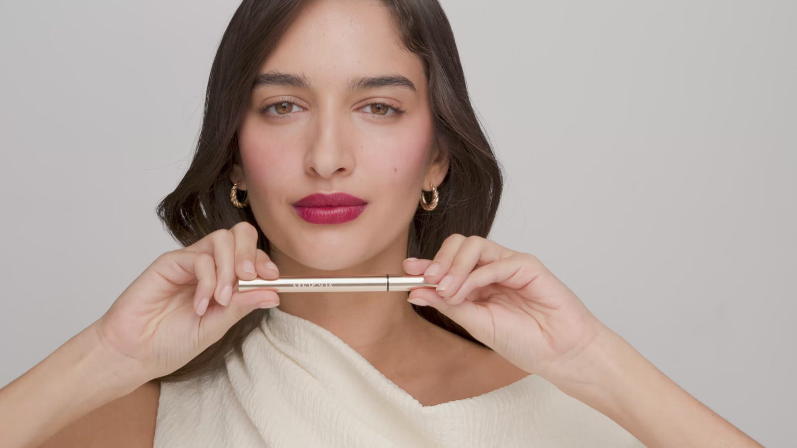 It's All About The Wing Liquid Waterproof Eyeliner applied with a gold pen for a sharp, black winged look.