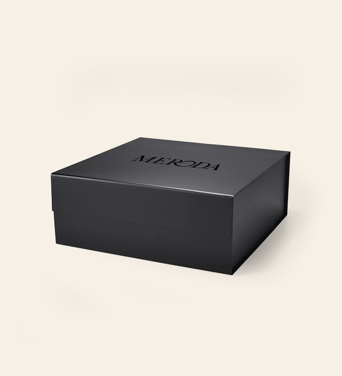 The matte black Gift Box featuring a sleek magnetic closure and the Meroda logo for a luxurious finish.