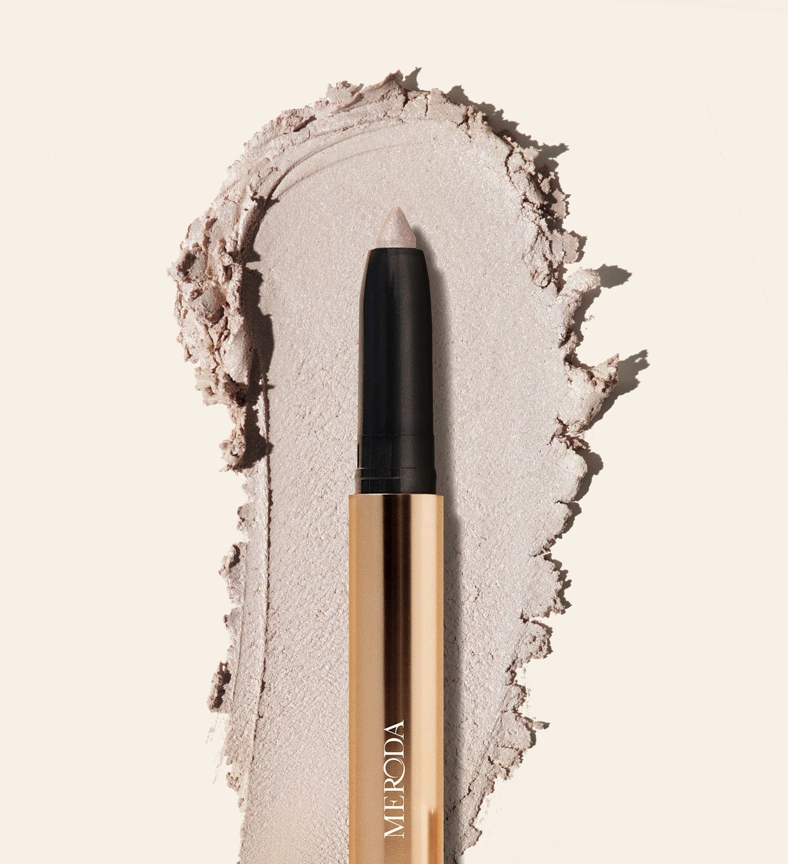 Eye Perfecting Shimmer Stick in Pearl with a creamy, radiant texture swatch to brighten your eye colour.